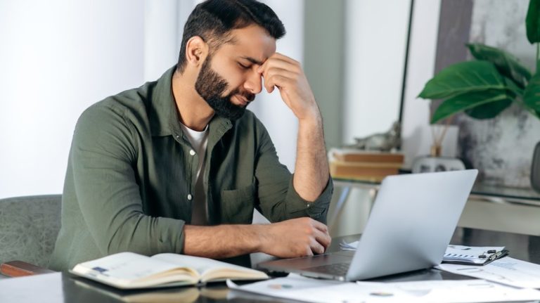 What it means to get a headache after a dentist appointment Individual holding head due to headache