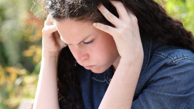 A Comprehensive Guide to Adult-Onset ADHD Girl struggling to focus